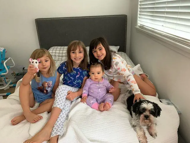 Rubi with her three sisters and dog, Sheldon