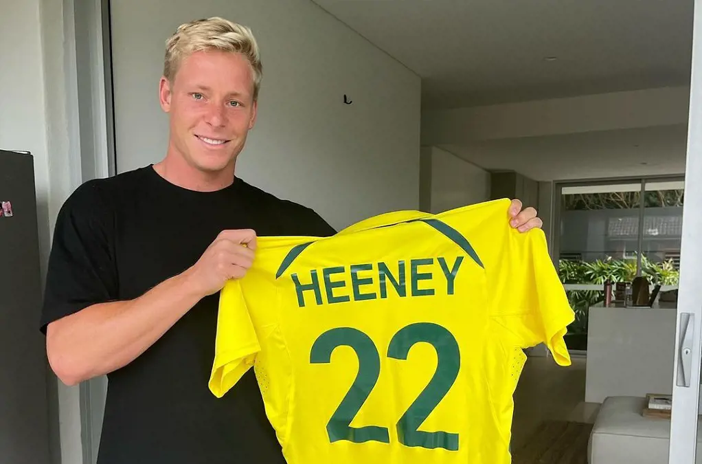 Issac Heeney with his jersey, number 22.
