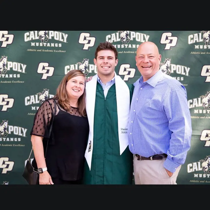 Zach with his parents on graduation day